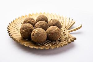 Bajra Atta Ladoo or kuler laddoo - Millet Flour Laddu, a popular winter sweet snack food from India photo