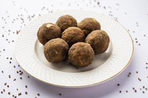 Bajra Atta Ladoo or kuler laddoo - Millet Flour Laddu, a popular winter sweet snack food from India photo