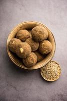 Bajra Atta Ladoo or kuler laddoo - Millet Flour Laddu, a popular winter sweet snack food from India photo