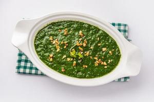 lasooni palak recipe or dhaba style garlic spinach curry, Indian main course served with naan photo