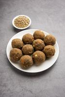 Bajra Atta Ladoo or kuler laddoo - Millet Flour Laddu, a popular winter sweet snack food from India photo