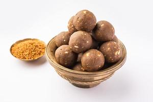 Fenugreek or methi ke Laddu, laddo or laddoo or sweet mithai balls for boosting immunity in winters photo