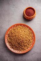 Nachni or Ragi Sev is a delicious crispy noodle made from finger millets, healthy Indian food photo