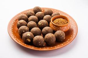 Fenugreek or methi ke Laddu, laddo or laddoo or sweet mithai balls for boosting immunity in winters photo