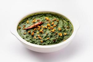 lasooni palak recipe or dhaba style garlic spinach curry, Indian main course served with naan photo