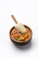 Idly lollipop or idli candy with stick served with sambar and chutney,South indian breakfast photo