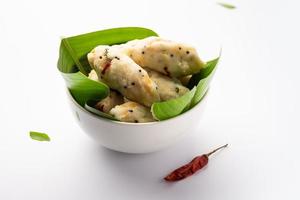 Kozhukatta Pidi is a steamed snack food from kerala rice flour with finger impressions photo