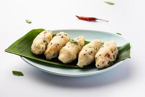 Kozhukatta Pidi is a steamed snack food from kerala rice flour with finger impressions photo