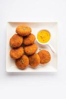 Macher Chop - Bengali style fish cutlet or pakora, a popular festival snack from west Bengal photo