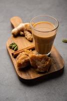 Jaggery tea or Gur ki chai with ingredients like gud, ginger or adrak, green cardamom and cinnamon photo