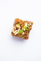 Dodha Barfi or Doda Burfi is a traditional Indian sweet, which has a grainy and chewy texture photo