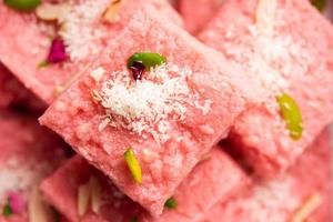 Rose Kalakand pink barfi or burfi also known as flavoured Mishri Mava Or Khoa Milkcake mithai photo