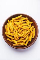 Bhajni chakli sticks or crunchy murukku snack made using diwali festival, favourite munching food photo