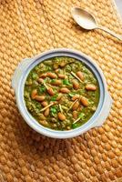 Palak rajma Masala is an Indian curry prepared with red kidney beans and spinach cooked with spices photo