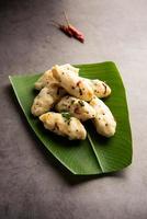 Kozhukatta Pidi is a steamed snack food from kerala rice flour with finger impressions photo