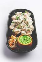 vegetarian soya malai chaap made using soya chaap with white creamy gravy photo
