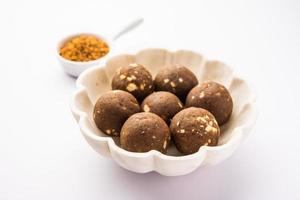 Fenugreek or methi ke Laddu, laddo or laddoo or sweet mithai balls for boosting immunity in winters photo