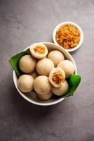 kozhukatta or kolukattai pidi is Steamed dumplings made with rice flour, filling coconut, jaggery photo