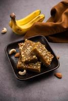 Banana Burfi or pakke kele ki barfi is a delicious Indian dessert made during festivals and special occasions photo