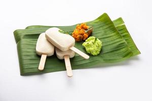 Idly lollipop or idli candy with stick served with sambar and chutney,South indian breakfast photo