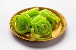 Green Jalebi mithai or sweet from India, a Twist to a traditional imarti or jilbi photo