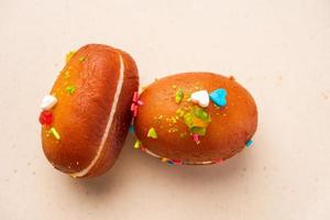 Malai Chop or Cream sandwich made using filling Rasgulla or Gulab jamun sweet is a Bengali sweet photo