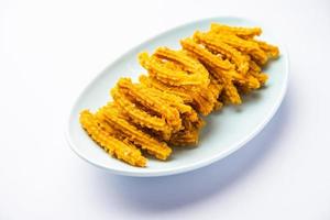 Bhajni chakli sticks or crunchy murukku snack made using diwali festival, favourite munching food