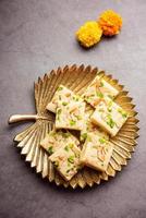 Milk powder barfi also known as Mava burfi, white Khoya burfi or Barfee, Indian Sweet food photo