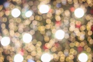 Abstract bokeh lights. Bokeh blur of lights at night. Bright blue, gold, white glow circle background for festive, Christmas, and new year. with copy photo