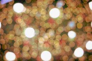 Abstract bokeh lights. Bokeh blur of lights at night. Bright blue, gold, white glow circle background for festive, Christmas, and new year. with copy photo