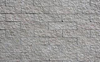 modern style of stone wall decoration texture dark brick wall texture background wall Brickwork or stone floor inside, clean old pattern stone, uneven concrete grid, heaps of bricks design. photo