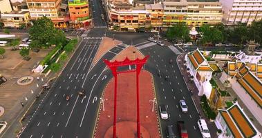 An aerial view of Red Giant Swing and Suthat Thepwararam Temple at sunset scene, The most famous tourist attraction in Bangkok, Thailand video