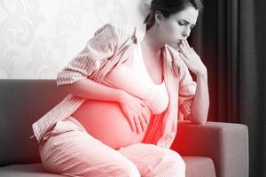 Pregnant woman at home feels sick photo