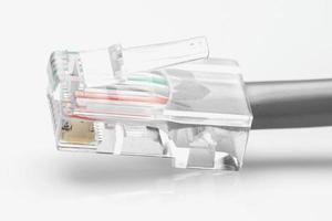 Ethernet wire with a plug on white background photo