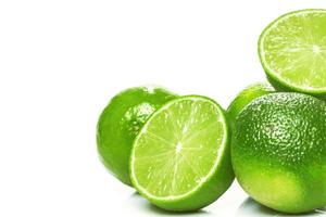 Fresh green lime fruits on white background photo
