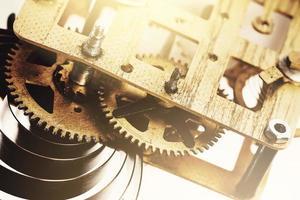 Old brass clock mechanism with gears photo