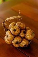 Wild salak fruit on wooden table photo