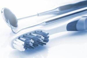 Closeup of toothbrush and dental equipment photo