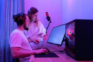 Couple looking at computer screen photo