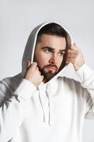 Handsome man wearing blank white hoodie and pants photo