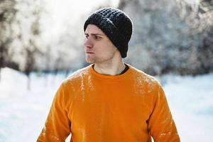 Young jogger man during his workout in winter park photo