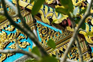 Closeup of beautiful bright decorations in ancient temple in Thailand. photo