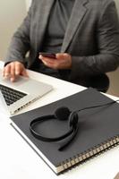 Headset on the table call center worker's workplace photo