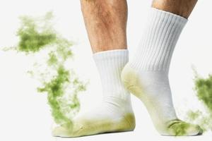 Male feet with smelly dirty socks photo