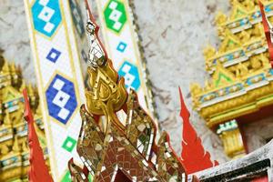 Closeup of beautiful bright decorations in ancient temple in Thailand. photo