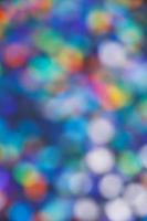 Abstract bokeh background of blurry multicolored light spots. photo