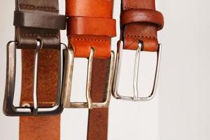 Leather belts hanging photo