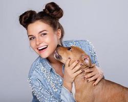 Happy woman and little staffordshire terrier photo