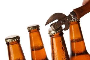 Bottles with beer and vintage opener photo