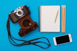 Retro camera and notepad photo